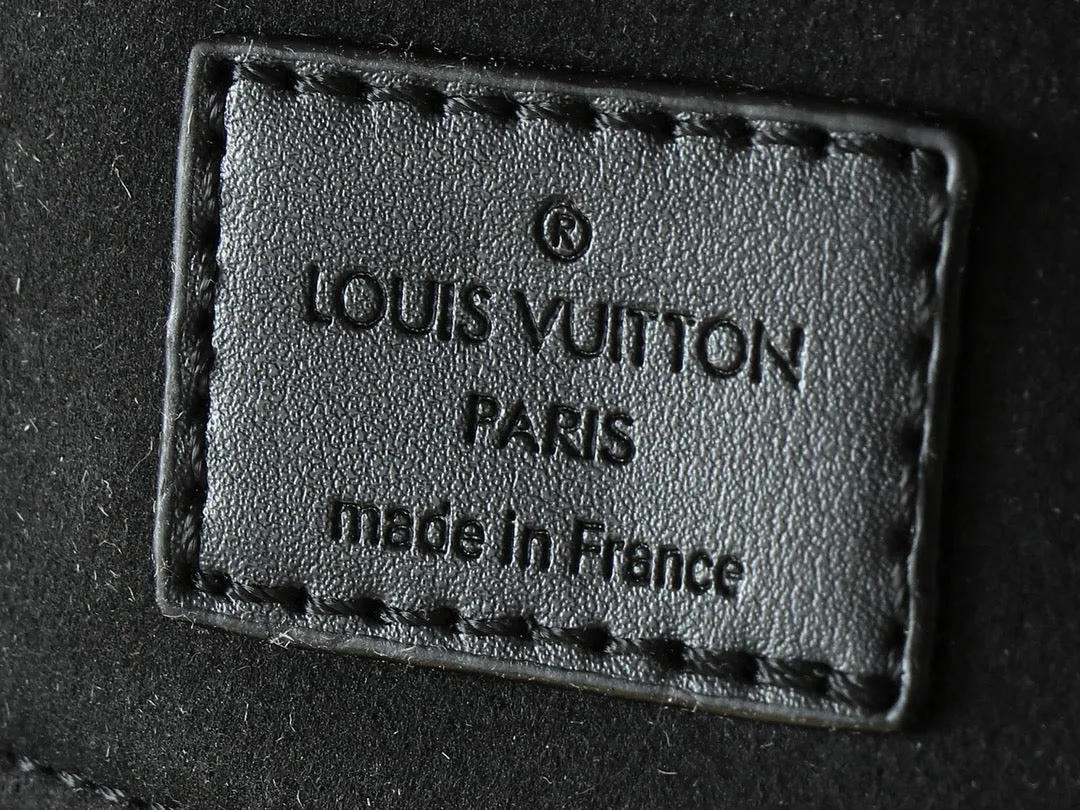 LV Nanogram Embossed Leather Clutch